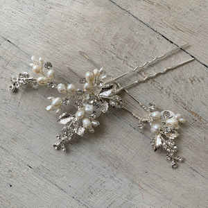 Set of freshwater pearls and silver rhinestone bridal hairpins.